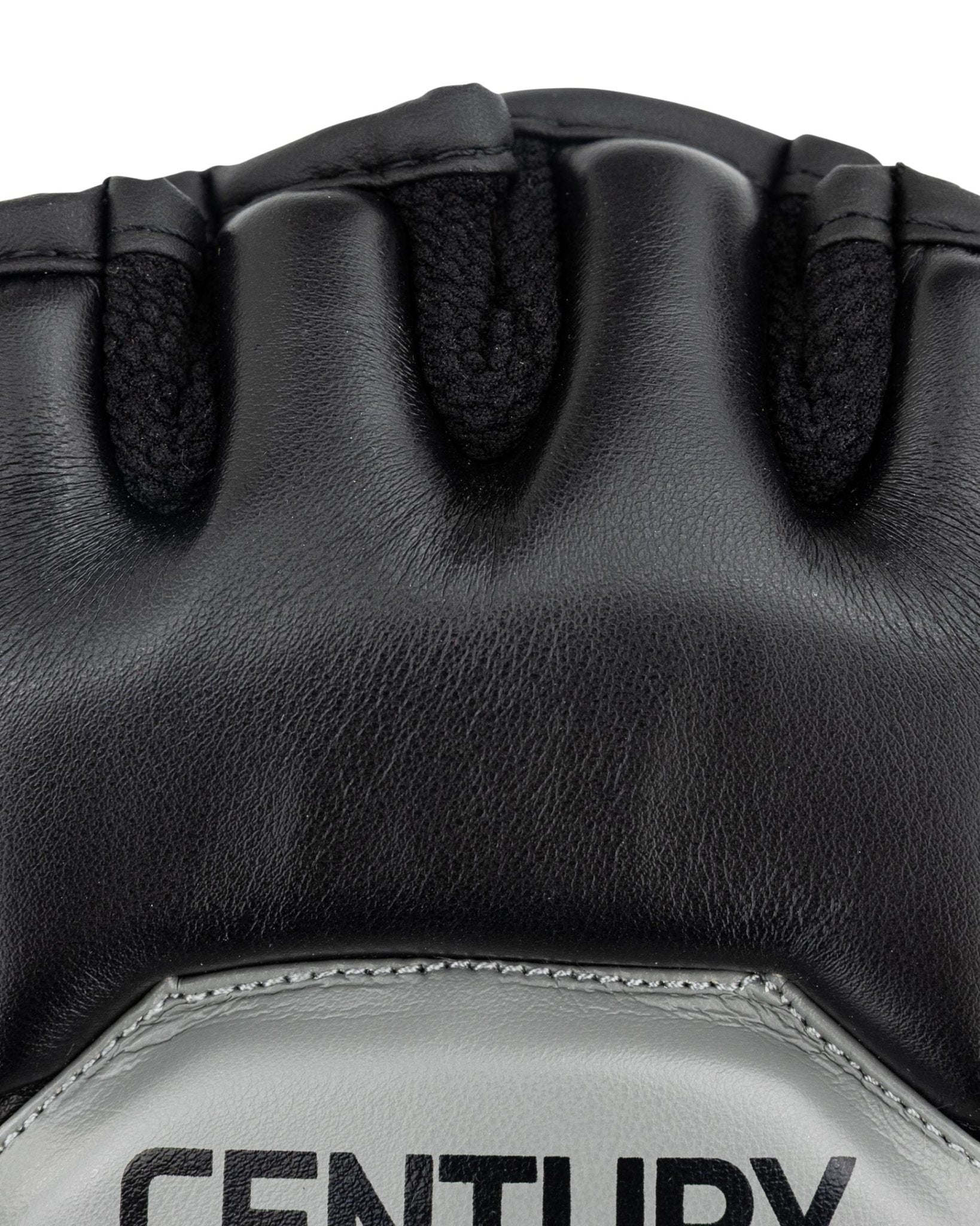 Youth fight gloves close-up: textured black wrist and finger knuckle grips