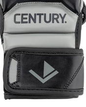 Youth fight gloves close-up: Century logo on light grey panel over black padding
