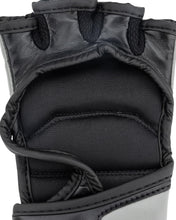 Youth fight gloves in black and dark gray, padded knuckle and wrist close-up