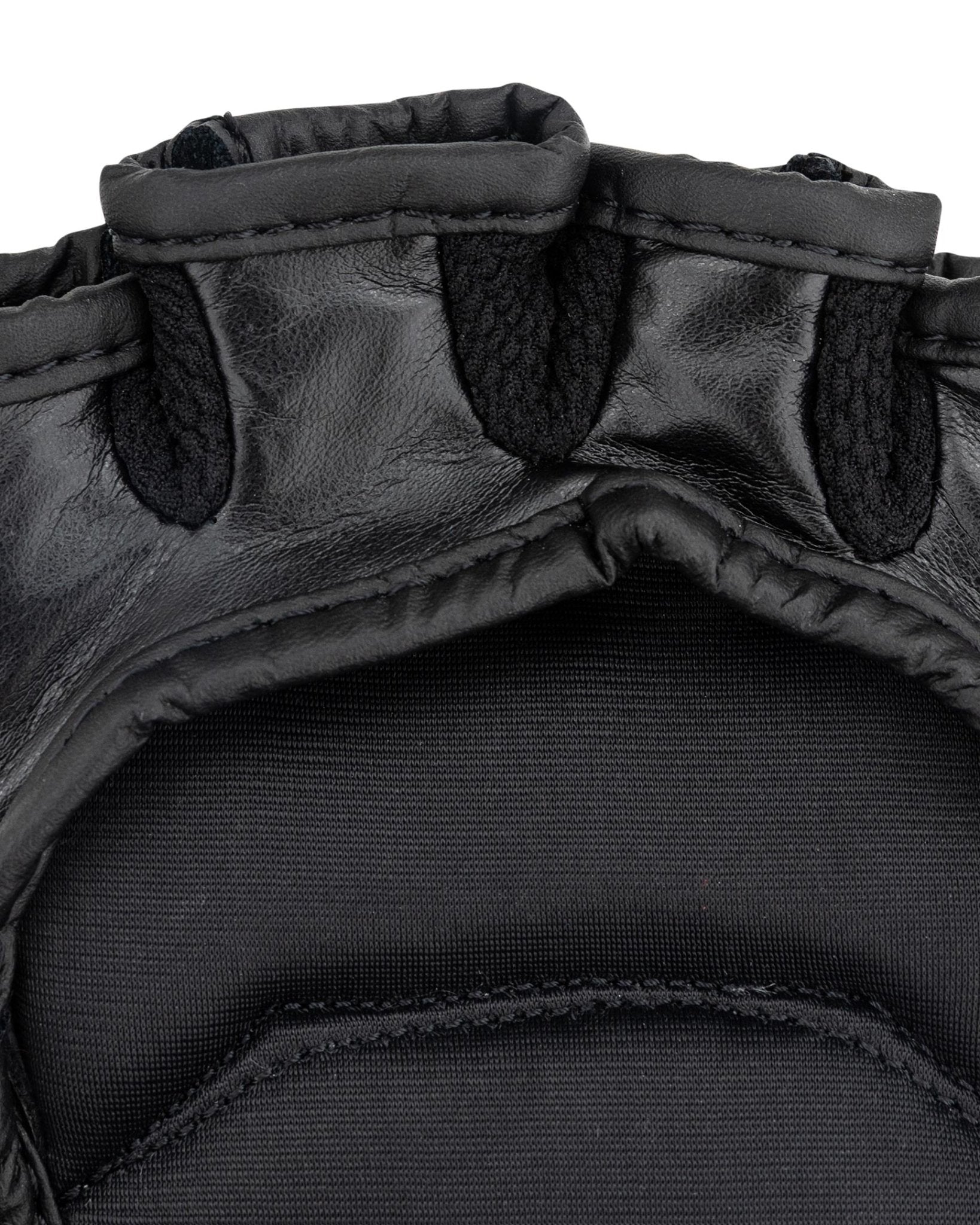Youth fight gloves close-up: padded thumb seam and black interior mesh