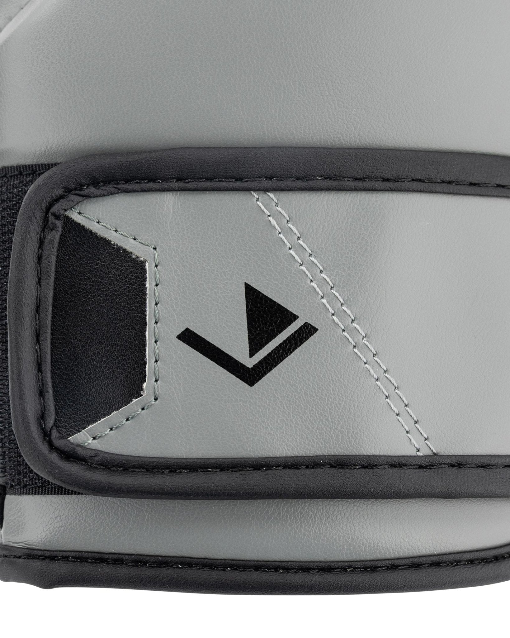 Grey youth heavy bag glove wrist strap detail with black logo patch