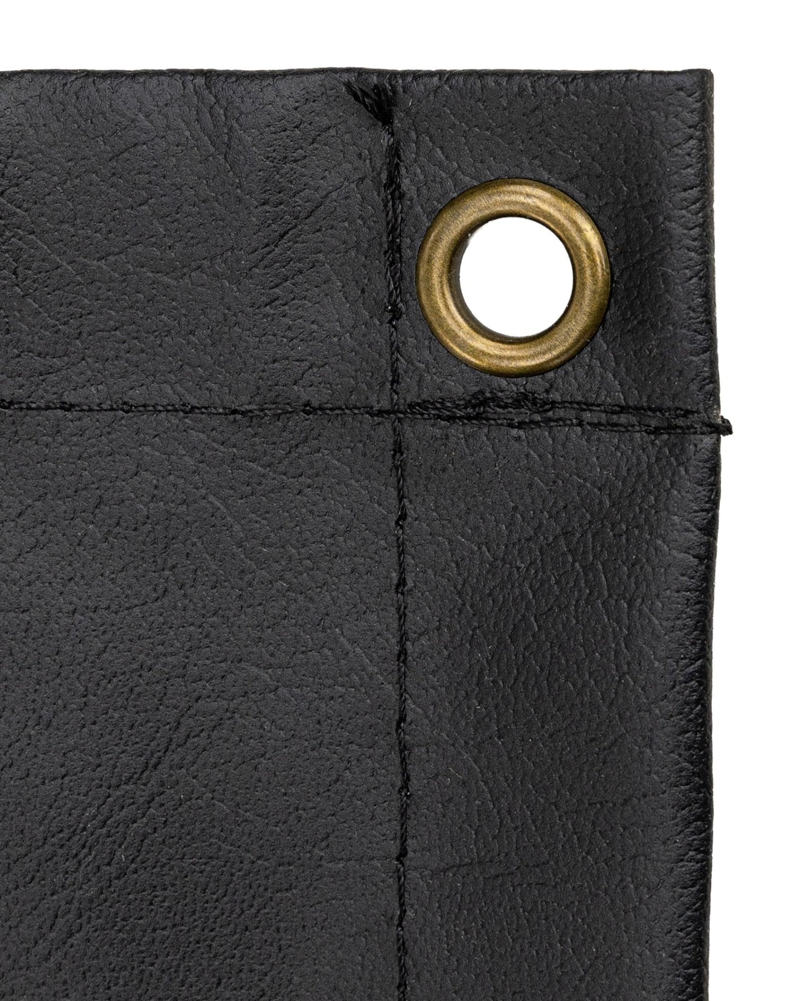 Black fabric banner corner with brass grommet eyelet