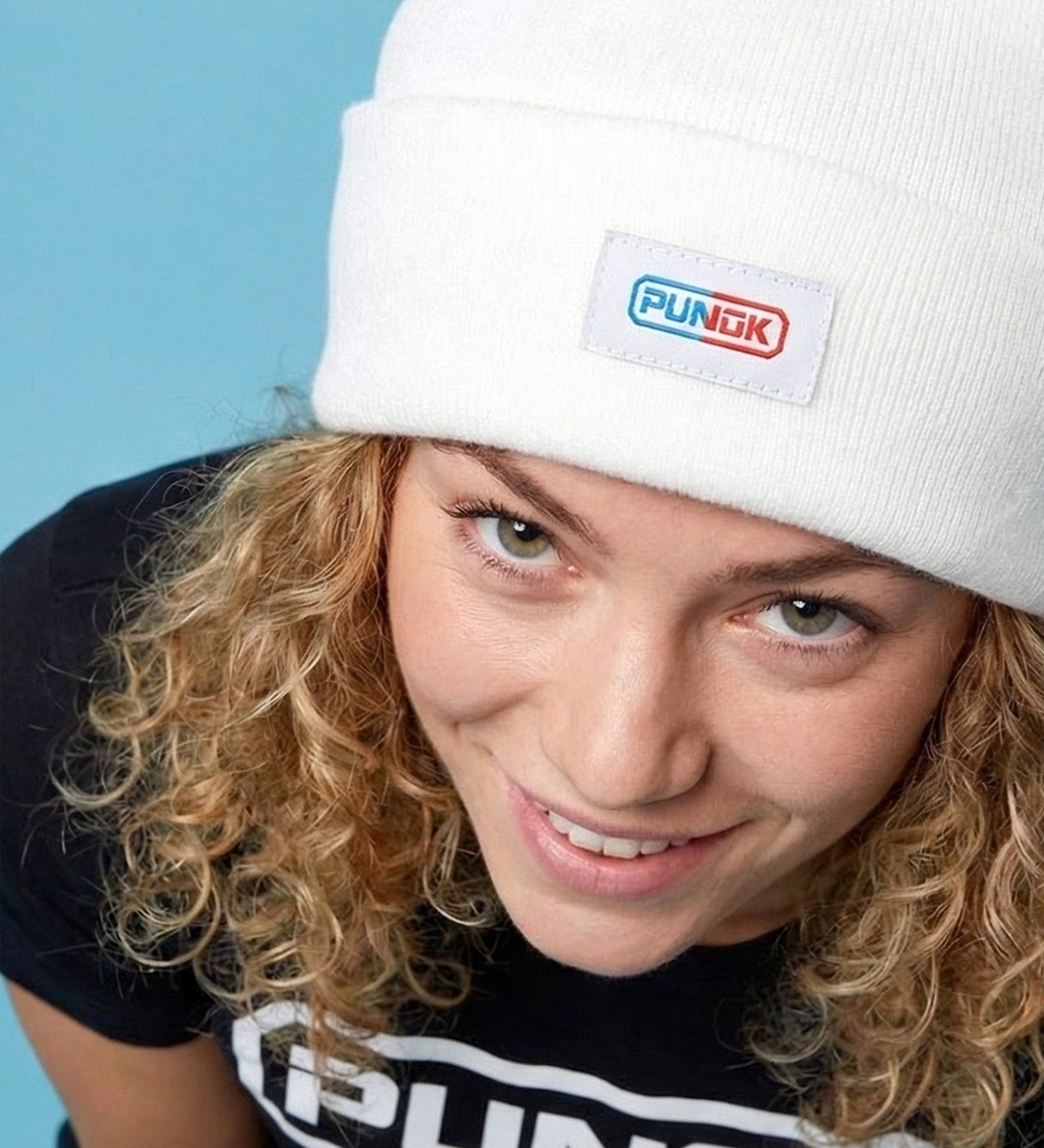 White Punok beanie on model with front logo patch