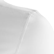 White compression top shoulder seam and smooth knit fabric detail.