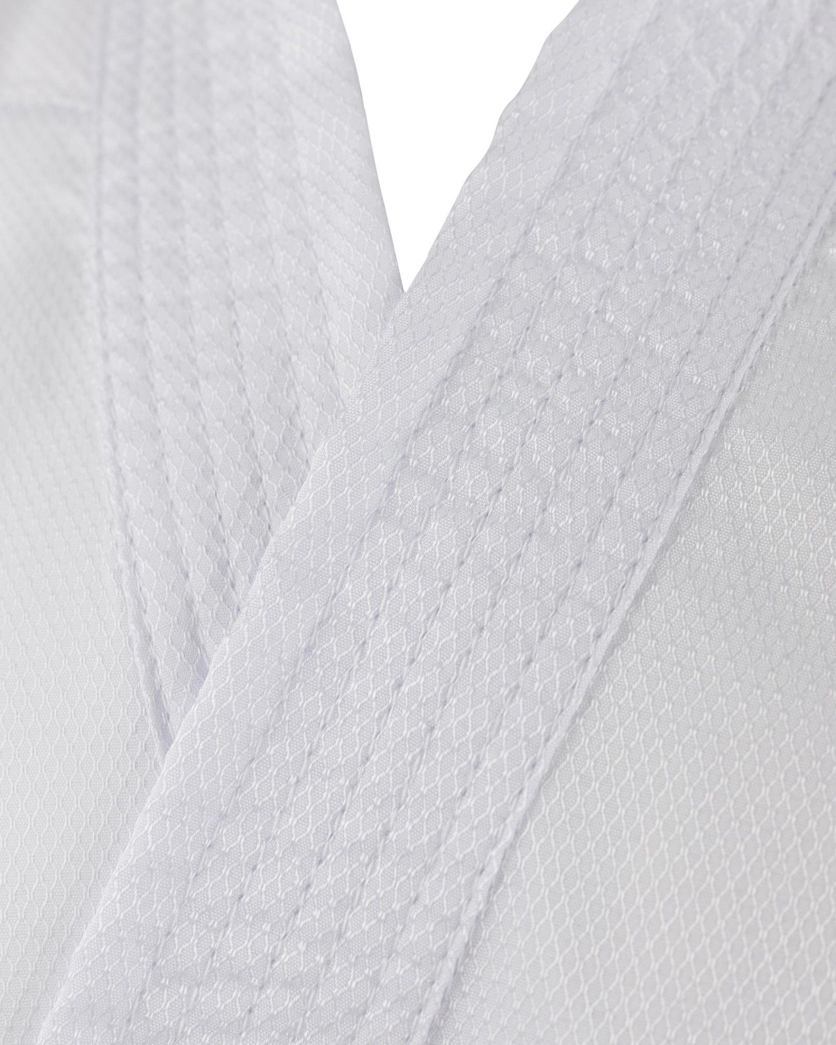 White karate gi fabric close-up with textured weave pattern