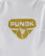 White karate gi top with gold Punok Takyon crest patch on chest