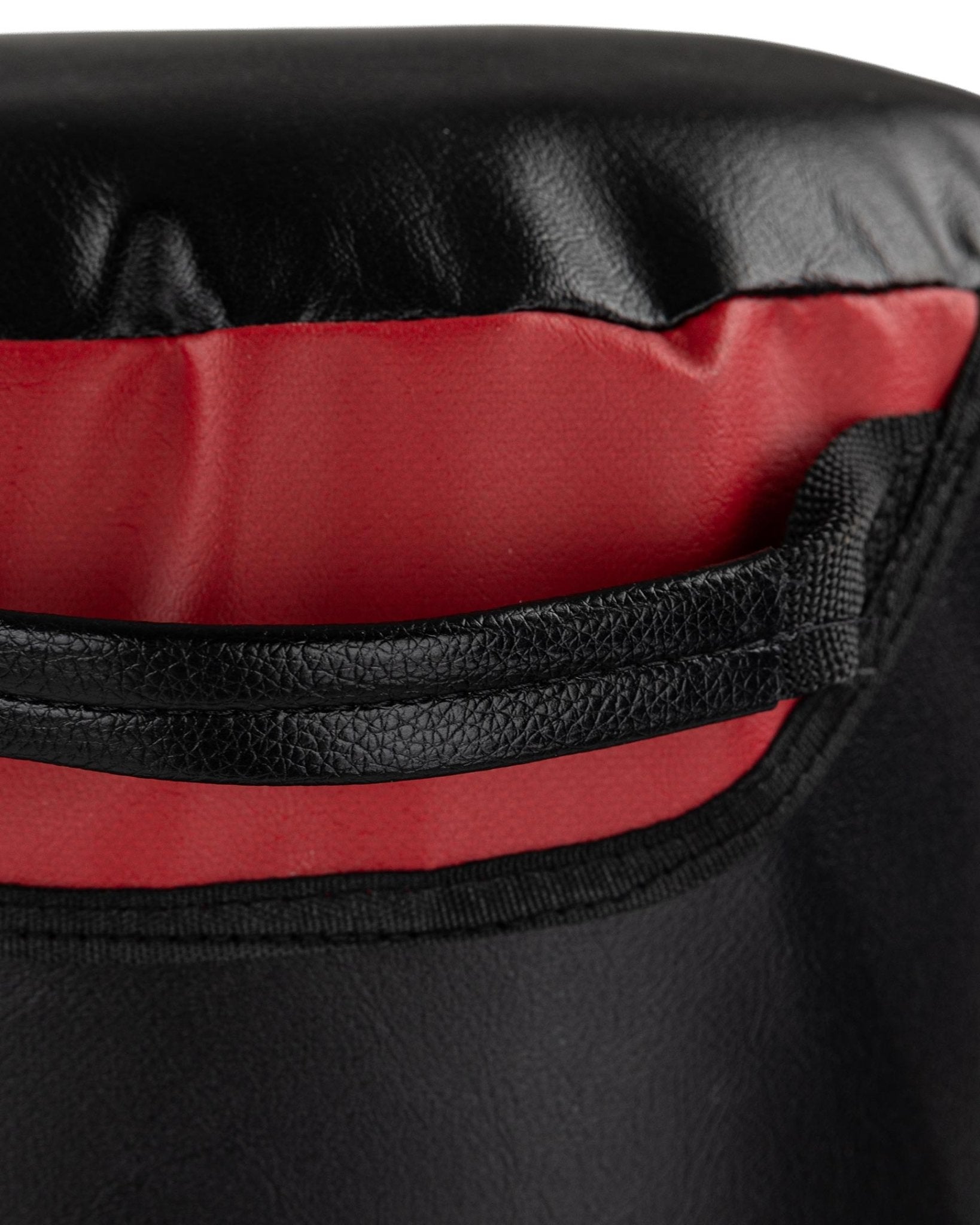 VS.1 heavy bag close-up of red and black stitched top rim