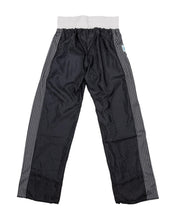 Tenacity pants in black with white waistband and grey patterned side panels