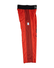 Tenacity pants in red with black waistband and black mesh center stripe