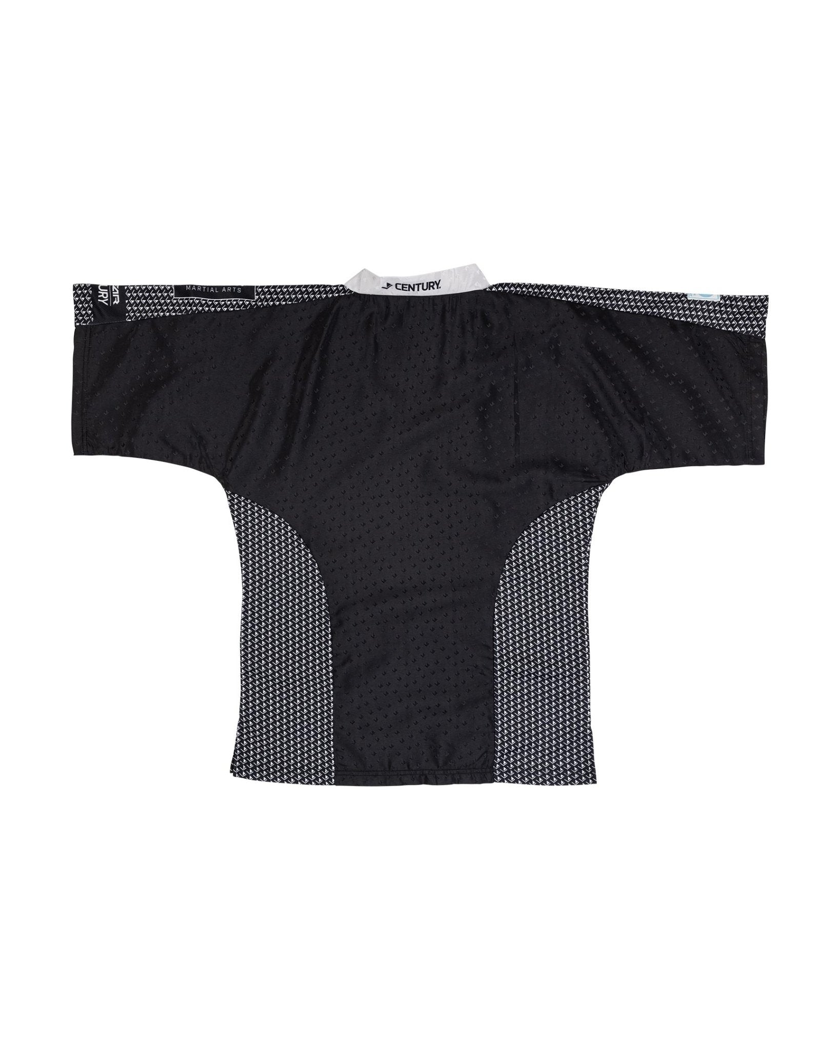 Black martial arts top with white trim around neckline and textured side panels