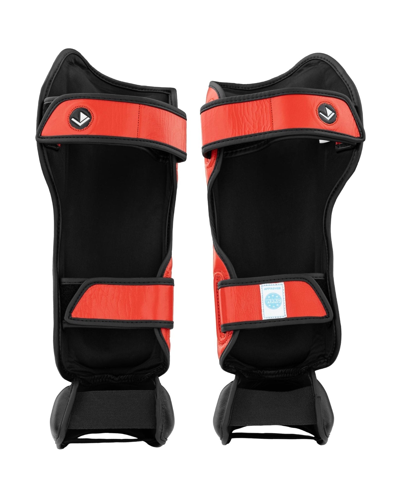 Shin instep guards in black with red trim and hook-and-loop straps