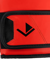 Red kickboxing glove cuff with black arrow logo and contrast stitching
