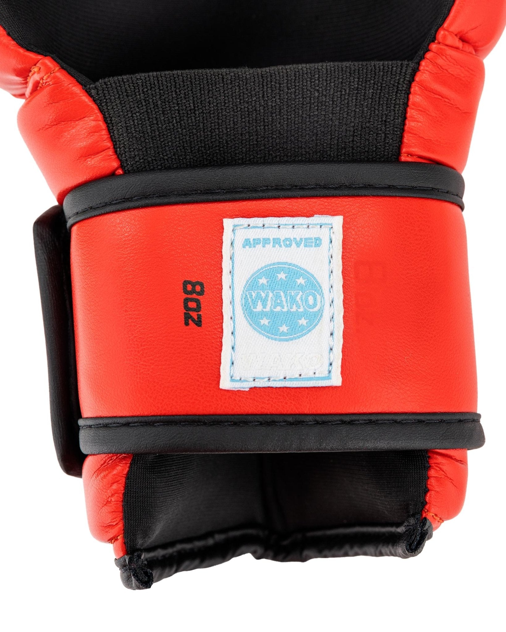 Red boxing glove wrist with black strap and WAKO patch label