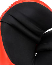Black inner hand padding on a red boxing glove