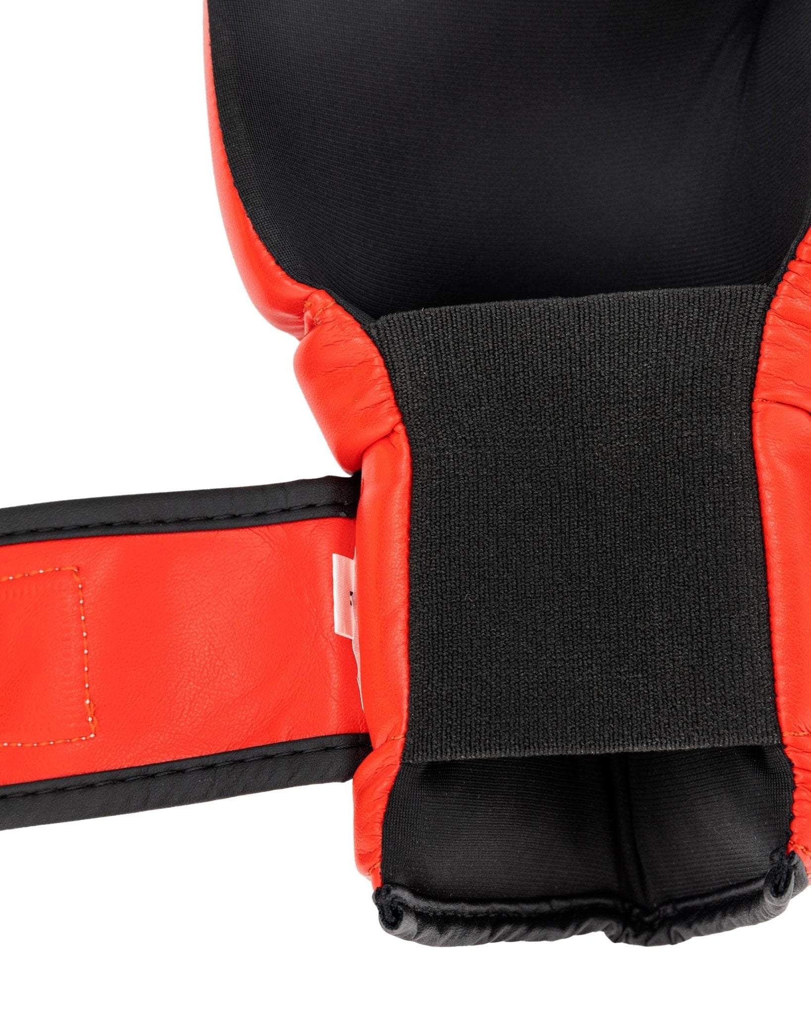 Black inner cuff and red boxing glove wrist strap close-up