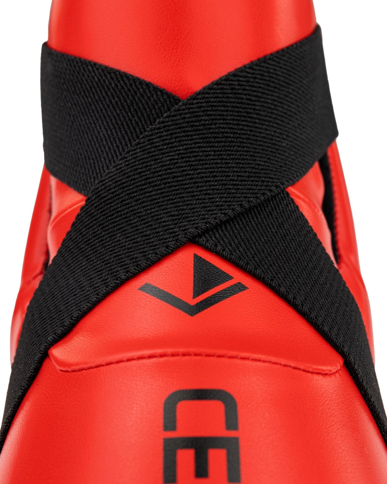 Close-up of red and black ankle kick upper with V and CENTURY logo