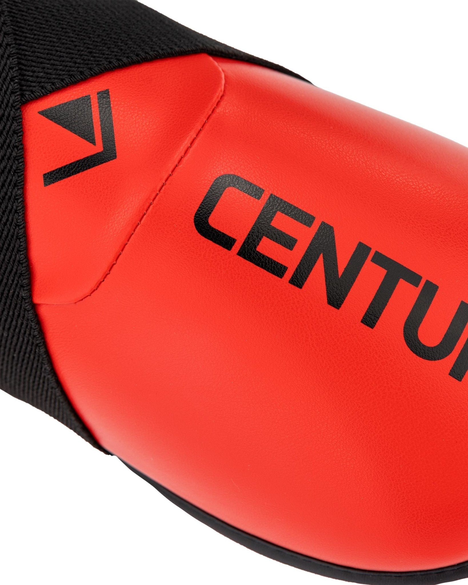 Close-up of red ankle kick side panel with CENTURY branding and V icon