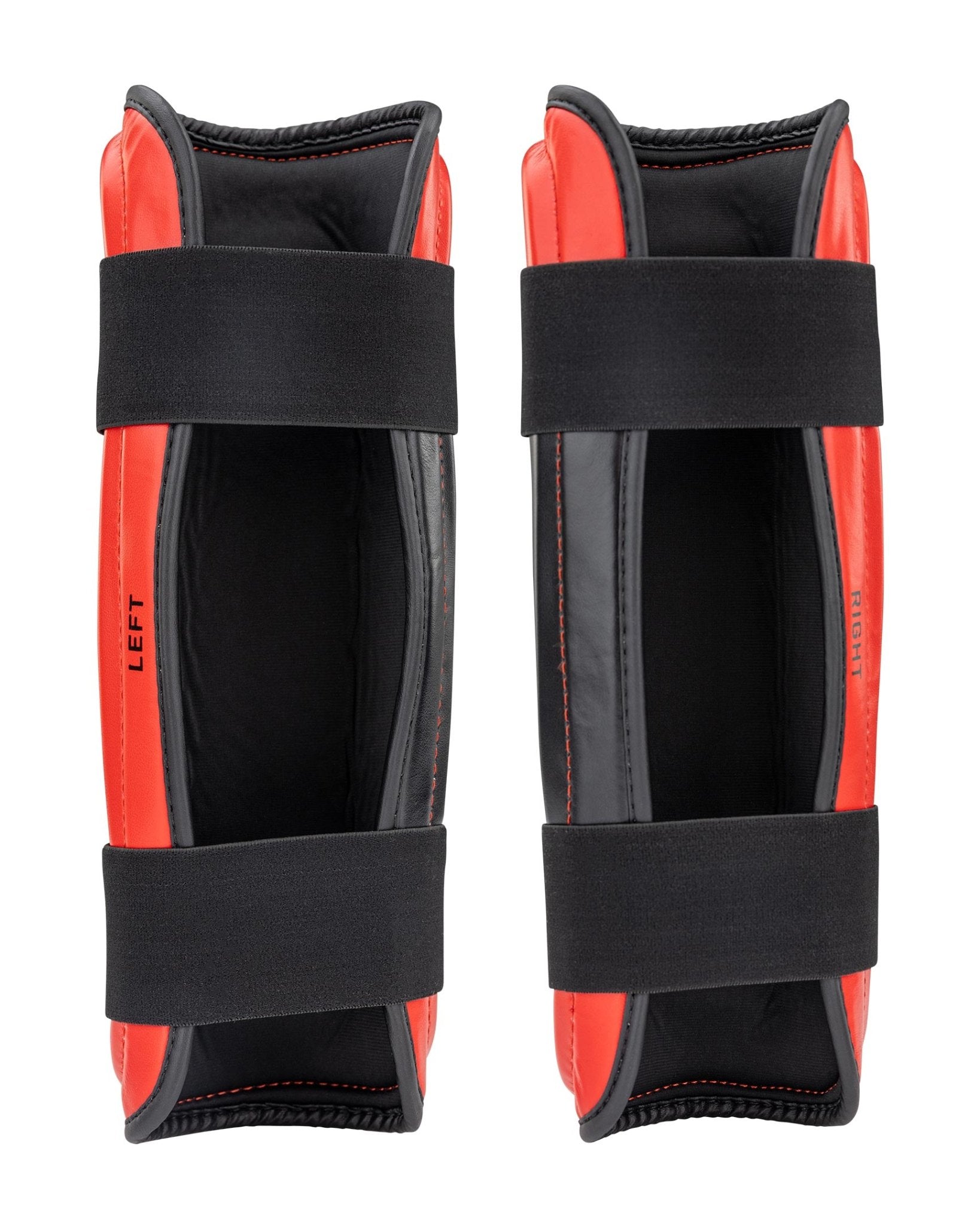 WAKO Drive shin guards in red and black, LEFT side label visible and black fastening strap.