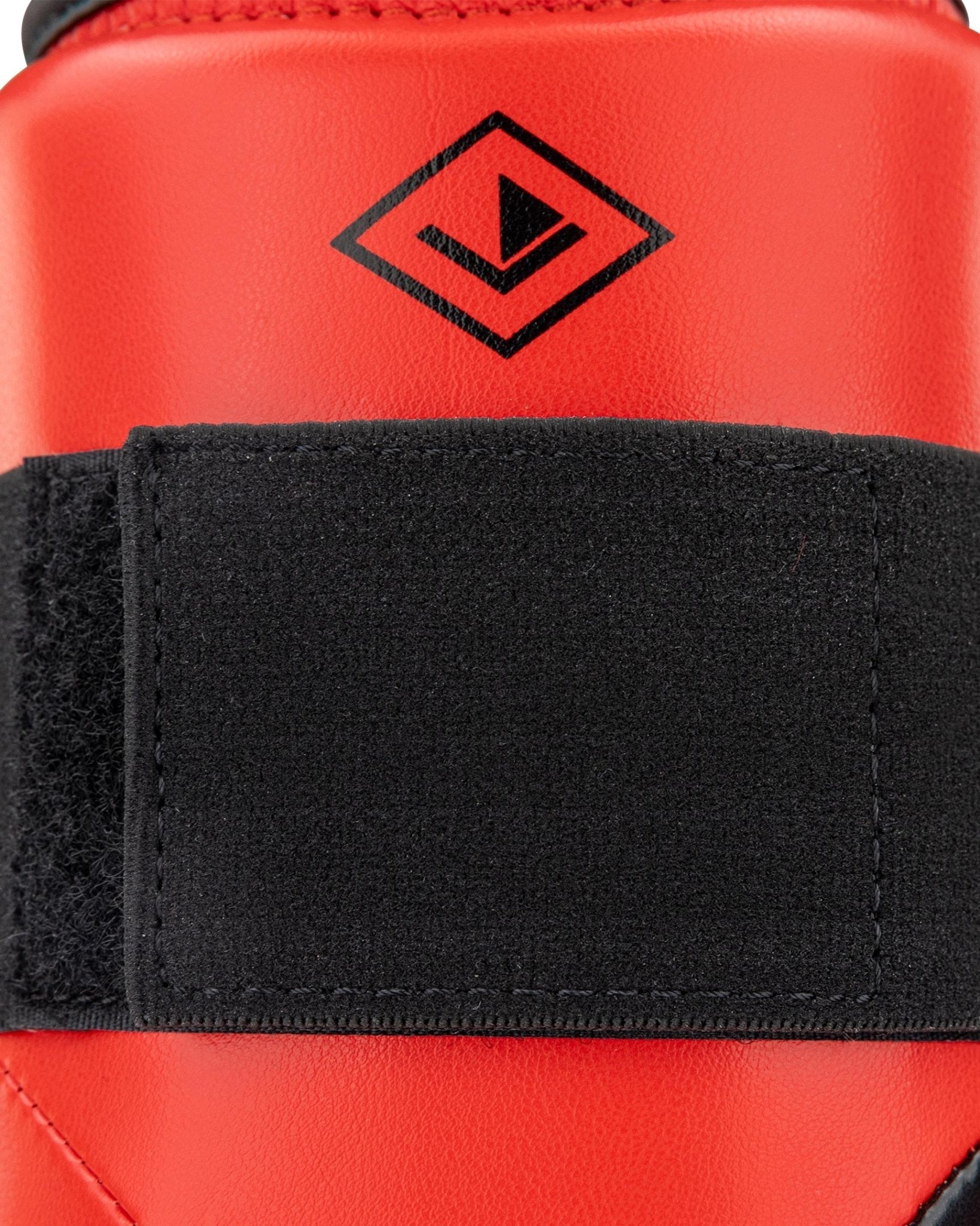 Red shin guard with black strap and WAKO Drive diamond logo