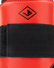 Red shin guard with black strap and WAKO Drive diamond logo