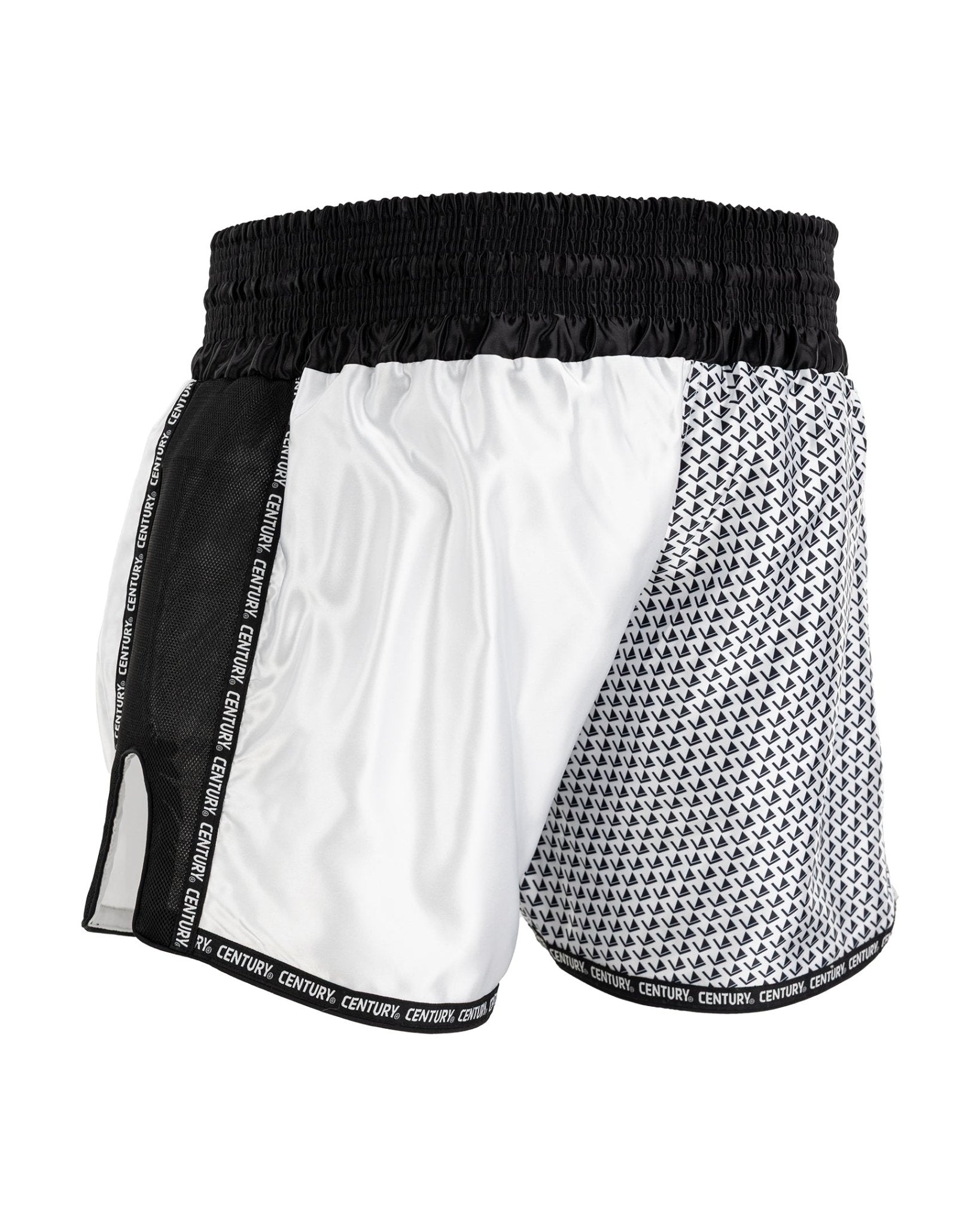 White and black kickboxing shorts with textured paneling and elastic waistband