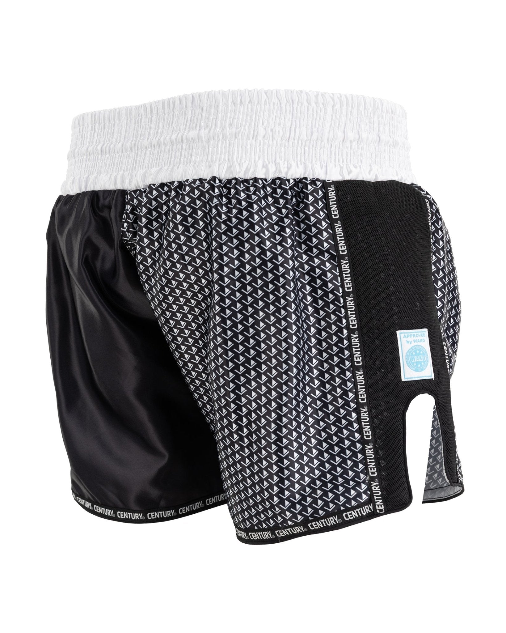 Black and white kickboxing shorts with textured pattern panel and elastic waistband