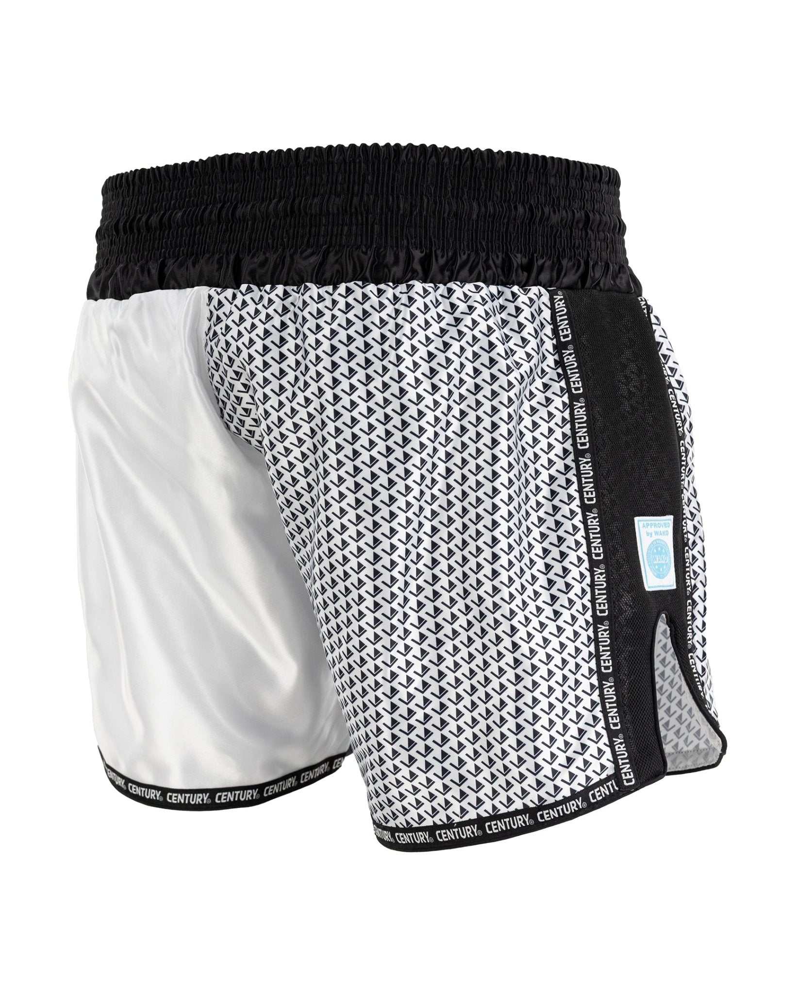Black and white kickboxing shorts with textured pattern panels and elastic waistband