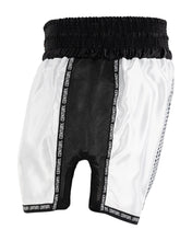 White kickboxing shorts with black side panels, elastic waistband, and leg opening cutouts