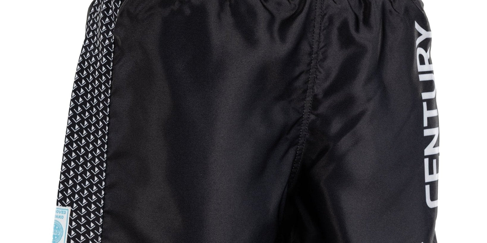 Black kickboxing shorts with white waistband; Century logo patch and side “CENTURY” lettering.