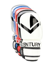 Boxing gloves with white outer pads and black V logo, blue and red trim, wrist strap