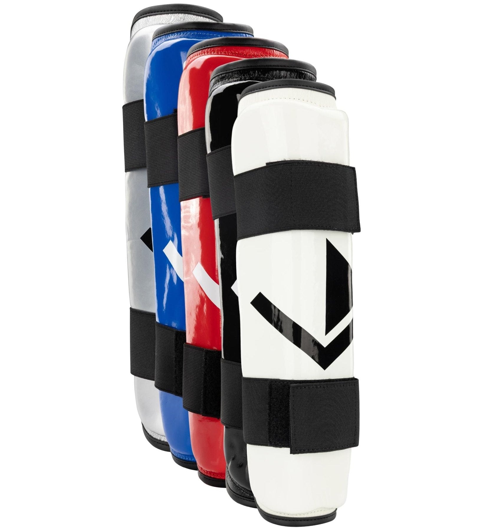 Multiple shin guards shown together in red, blue, white, and silver with black straps